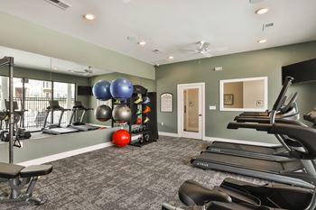 fitness center at Aventura Hawk Ridge apartments, MO
